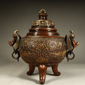 A Qing Dynasty copper wrong gold entwined lotus incense burner