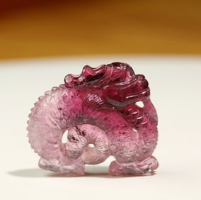 A Qing Dynasty tourmaline carving squatting dragon