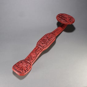 A Qing Dynasty red phoenix pattern ruyi handle