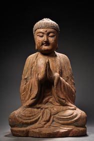 A painted wooden statue of Shakyamuni Buddha