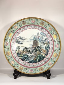 A Qing Dynasty Qianlong enamel pavilion landscape plate