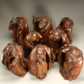 A Qing Dynasty bamboo root carving of the Eight Immortals figure ornament