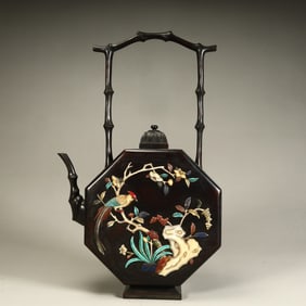 A Qing Dynasty mahogany carved treasure chest pot size