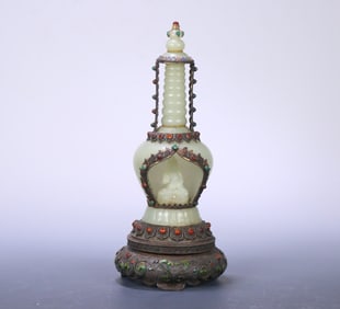 A Qing Dynasty Hetian jade-wrapped silver-gilt filigree Shakyamuni Buddha shrine