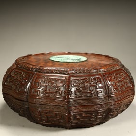 A Qing Dynasty mahogany inlaid jade Kui dragon pattern multi-edged lid box