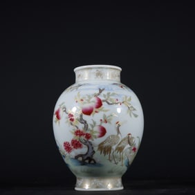 A Qing Dynasty Yongzheng pastel gold-painted longevity peach crane pattern vase