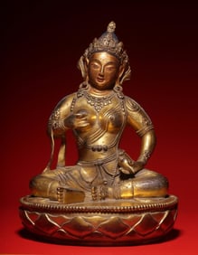 A seated statue of a bronze gilt female achiever in the Qing Dynasty