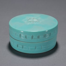A Qing Dynasty celadon carved longevity pattern cover box
