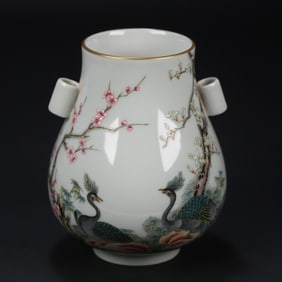A Qing Dynasty Qianlong pastel phoenix flower ear bottle
