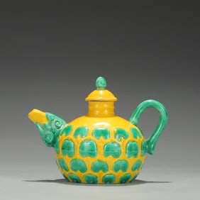 A Ming Dynasty Hongzhi yellow ground green lotus petal holding pot