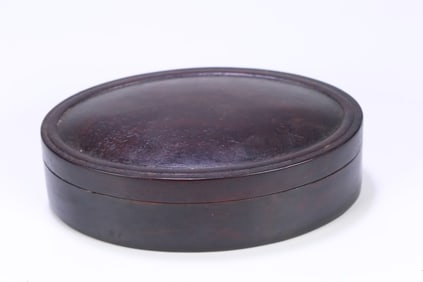 A Qing Dynasty rosewood oval poetry cover box