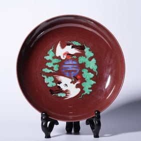 A Qing Dynasty Yongzheng year eggplant skin purple glaze three-color cloud crane group longevity