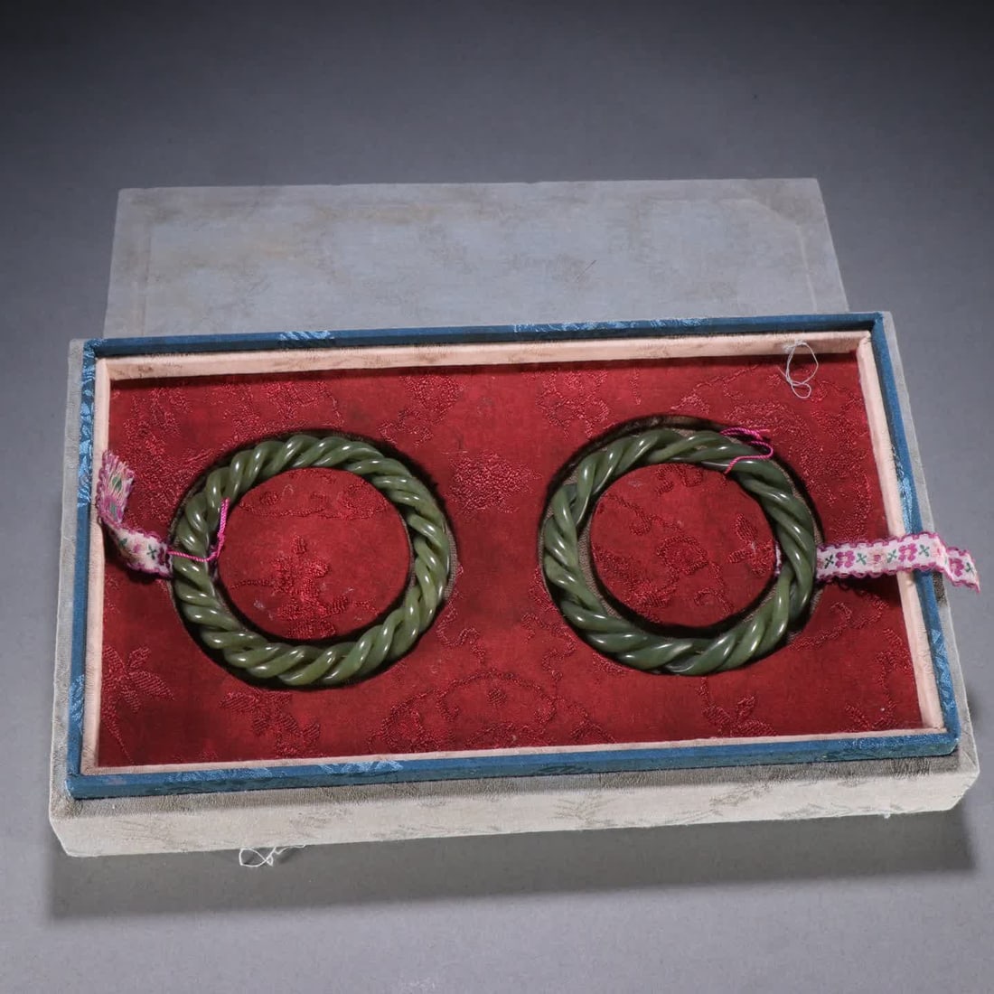 A pair of Qing Dynasty Hetian jade hollow twist bracelets (1 of 9)