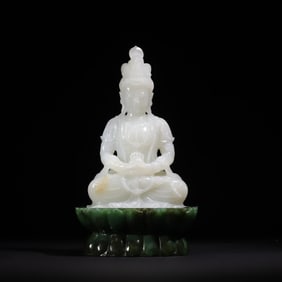 A Qing Dynasty white jade Guanyin sitting jasper lotus platform ornament