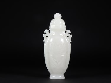A Qing Dynasty Hetian jade beast pattern double phoenix ear vase