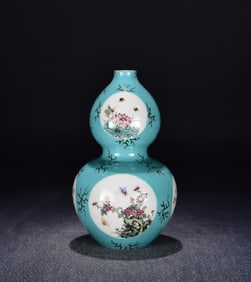 A Qing Dynasty Yongzheng green space consecrated pastel flower and bird poetry gourd bottle