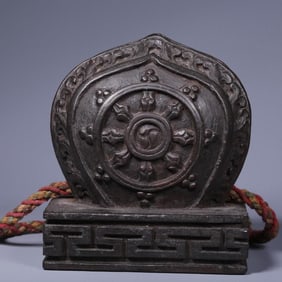 A Qing Dynasty rosewood carved Dharma wheel seal