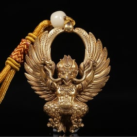 A Qing Dynasty copper gilt peng Ming Dynasty king pendant