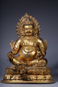 A seated statue of Shakyamuni Buddha with a gold crown crowned with alloy copper inlaid with silver