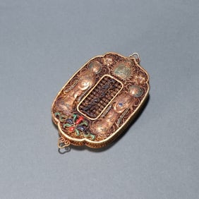A Qing Dynasty silver-gilt filigree fasting plaque