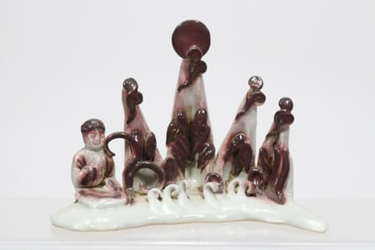 A Yuan Dynasty glazed red mountain-shaped pen holder