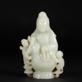 A seated statue of Guanyin with Hetian jade seed material