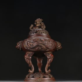 A Qing Dynasty copper dragon pattern three-legged aroma burner