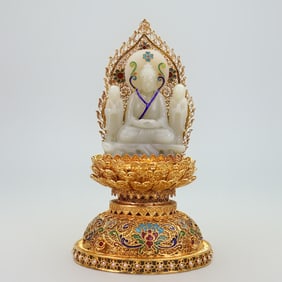 A copper gilt cloisonné Buddha statue ornament