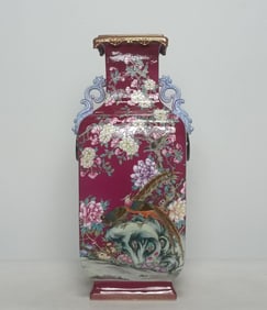 A pair of Qing Dynasty Qianlong enamel carmine red ground icing on the cake, square animal ears,