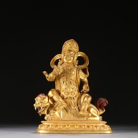 A seated statue of the Qing Dynasty bronze gilt treasure king