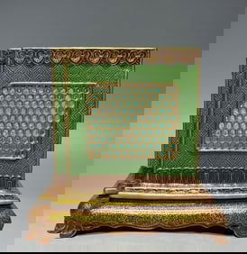 A Qing Dynasty Qianlong enamel green background hollow square pen holder