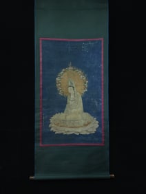 A statue of Ding Yunpeng sitting on the lotus in the Ming Dynasty