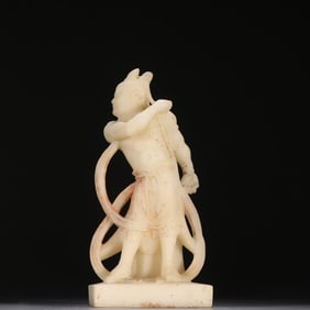 A statue of a white jade strongman from the Tang and Han dynasties