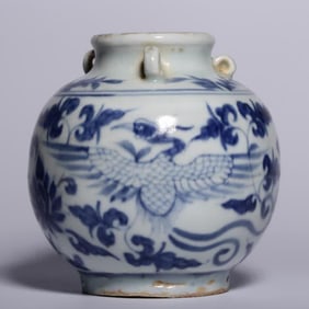 A blue and white phoenix wears a small jar with a peony pattern