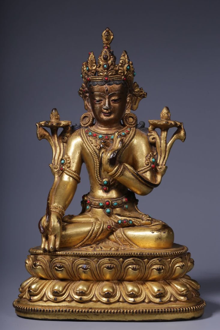 A seated statue of Guanyin with a bronze gilt inlaid treasure holding lotus in the Qing Dynasty (1 of 9)