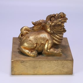 A Qing Dynasty copper gilt beast button seal