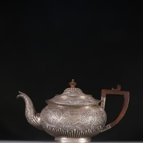 A sterling silver teapot