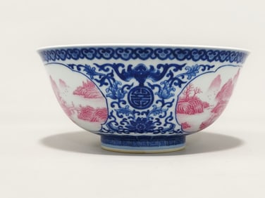 A Qing Dynasty Qianlong year blue and white entwined lotus with open window landscape pattern bowl