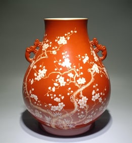 A Qing Dynasty Yongzheng alum red ground left white plum bamboo spring amphora rich tube bottle