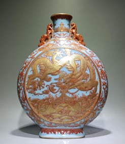A Qing Dynasty Qianlong azure glazed alum red gold-painted fish leaping dragon gate moon vase