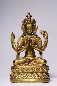 A four-armed seated statue of Guanyin with copper gilt inlaid treasures in the Qing Dynasty