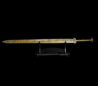 A Warring States bronze sword with gold slub