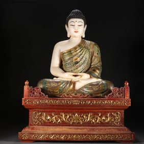 A Han Dynasty white jade painted statue of Shakyamuni painted in gold