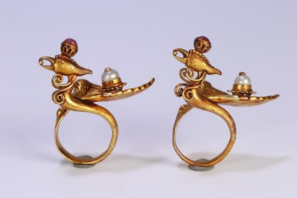 A pair of silver-gilt inlaid phoenix rings