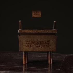 A Ming Dynasty precision cast copper tire wrong silver wire gluttonous pattern tripod furnace