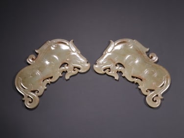 A pair of Han Dynasty Hetian jade tiger pendants
