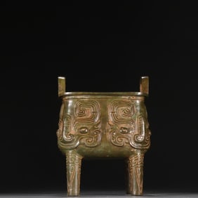 A bronze animal face pattern square tripod