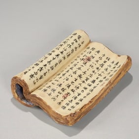 A Qing Dynasty bionic porcelain Zhen Zongyuan ancient book ornament