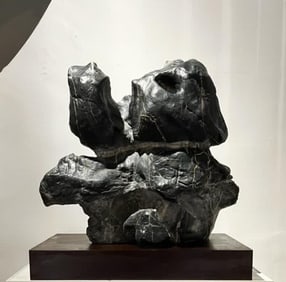 A Qing Dynasty Lingbi stone elephant study ornament