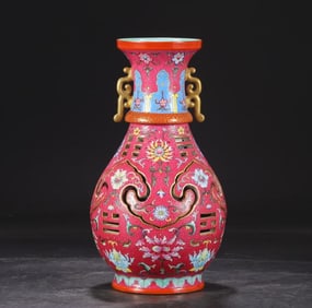 A Qing Dynasty Qianlong enamel colored gold-painted entwined floral pattern rotary core bottle